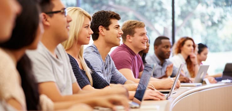 Class Of University Students Using Laptops In Lecture